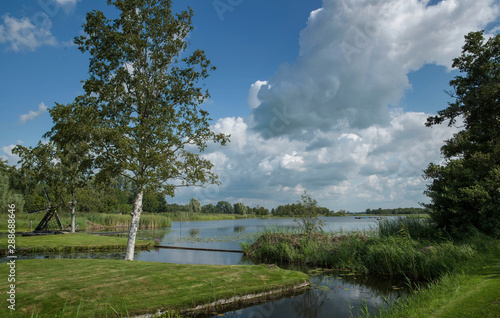 Dutch watervillage Giethoorn. Netherlands. Overijssel. Lake and trees photo