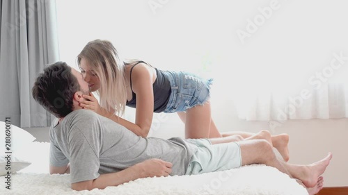Young couple kissing in the bed .loving couple in bedroom photo