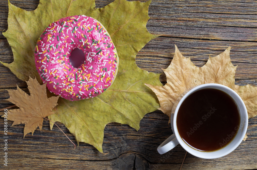 Donut, coffee and leaves