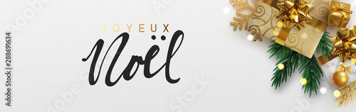 French text Joyeux Noel. Christmas banner, Xmas festive decoration. Horizontal christmas posters, cards, headers, website. Sparkling lights garland with gifts box and green pine branches.