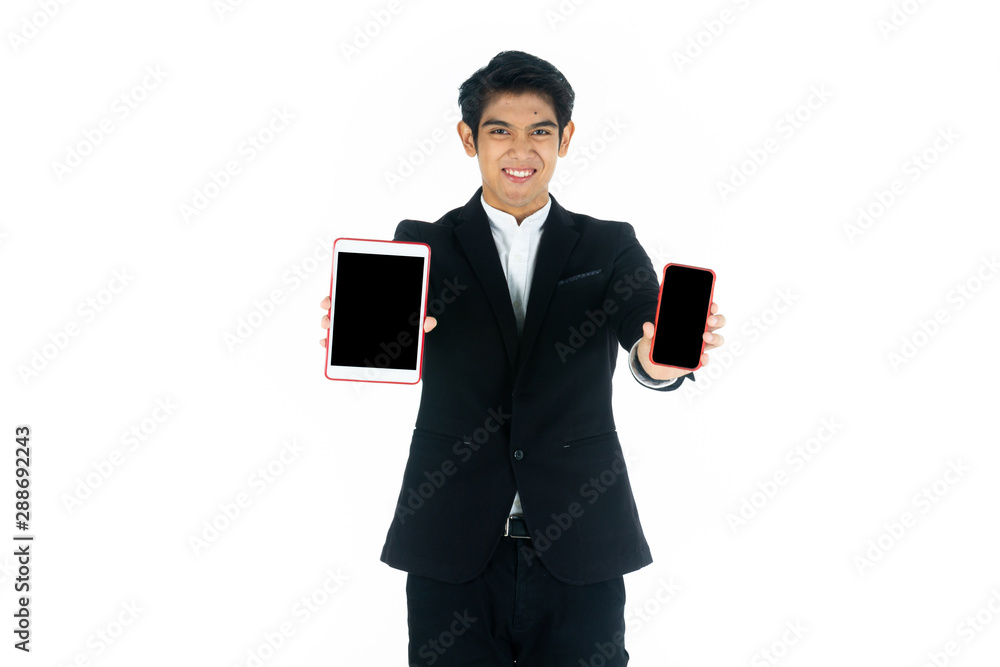 Handsome young businessman Asian caucasian wear a black suit with black hair, be a smile and standing smart poses. Two hands hold a tablet, smartphone and use it. On a white background. Handsome young businessman Asian caucasian wear a black suit with black hair, be a smile and standing smart poses. Two hands hold a tablet, smartphone and use it. On a white background.