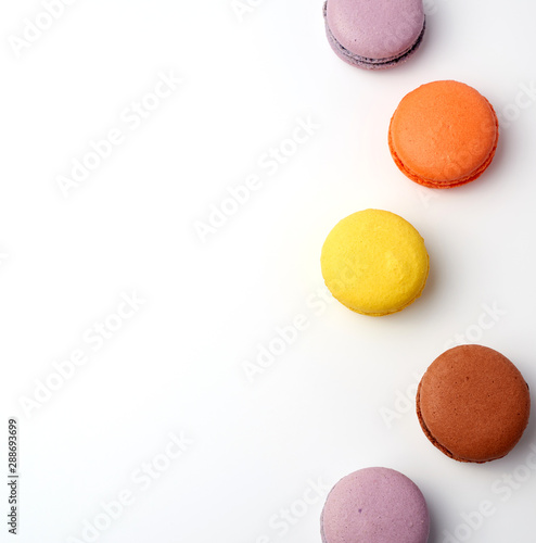 stack of colorful baked macaron almond flour on a white background
