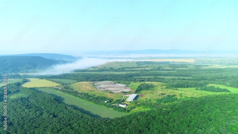 Aerial top view of Illegal garbage dump inside the forest. 4K. Aerial top view of Illegal garbage dump inside the forest. 4K.