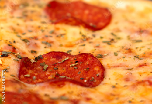 Pepperoni pizza closeup with blurred background