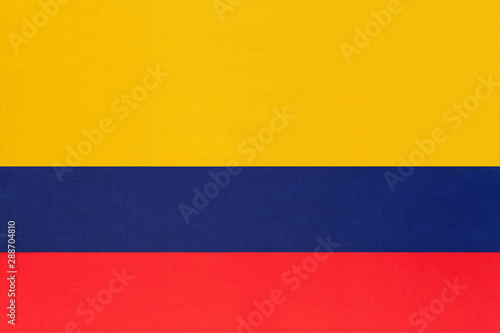 Colombia national fabric flag textile background. Symbol of international world south America country.