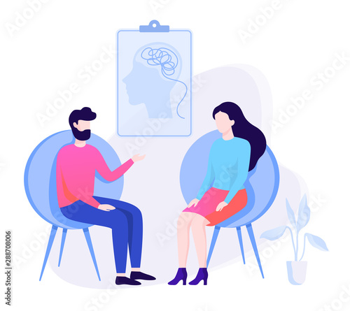 Sad man sitting on the chair talking to female psychologist.