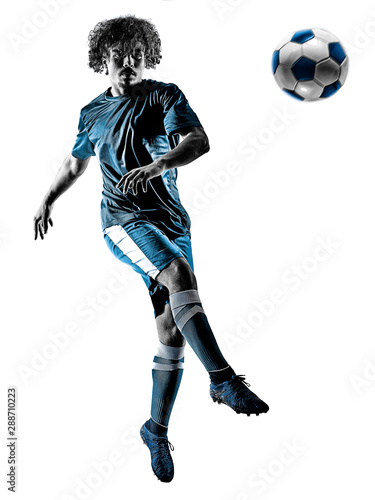 one mixed race young teenager soccer player man playing in silhouette isolated on white background