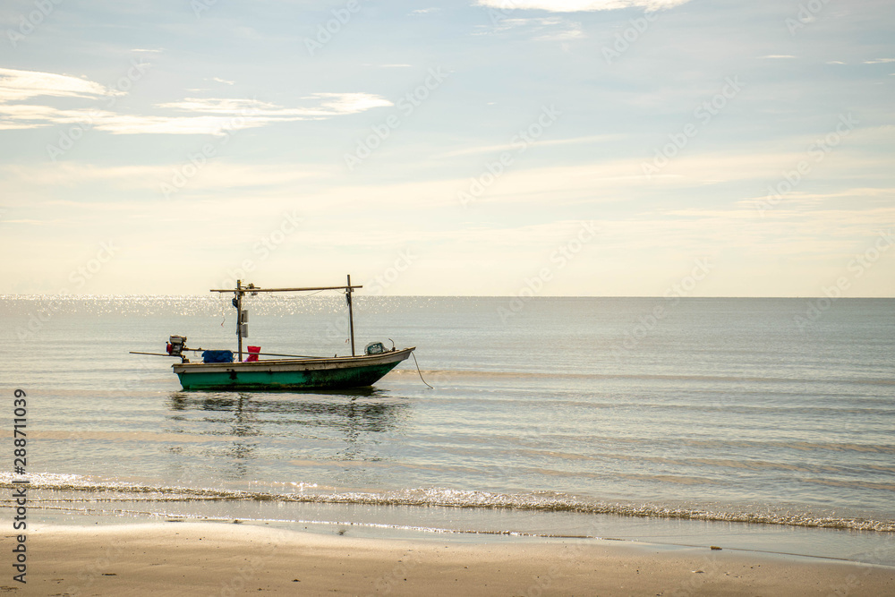 Small fishing boats park on the beach