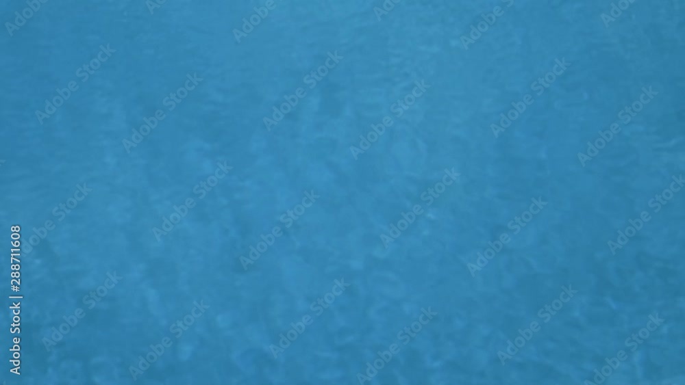 Blue water of a swimming pool with waves, beautiful background Blue water of a swimming pool with waves, beautiful background