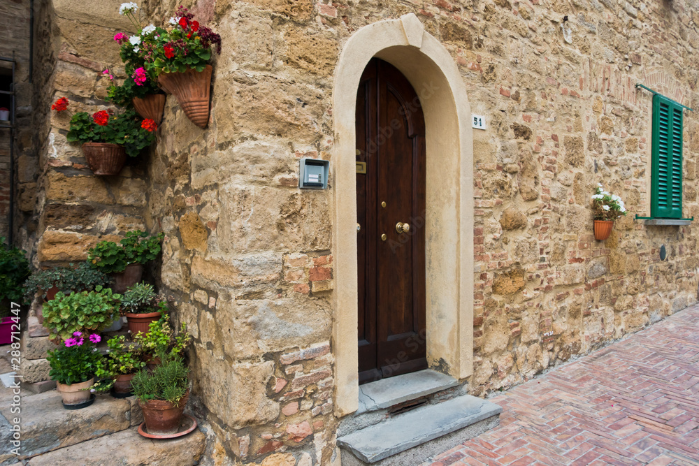 Architectural details of old houses at narrow winding streets of Volterra, Tuscany, Italy