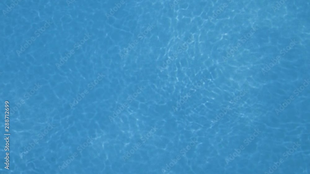 Blue water of a swimming pool with waves, beautiful background Blue water of a swimming pool with waves, beautiful background