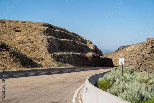 The steep grade of US-95 highway in Owyhee County Idaho through the canyon and mountains photo