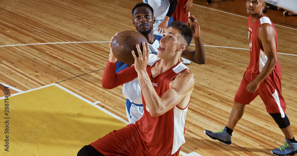 Fototapeta premium Professional basketball player in action on a sports arena