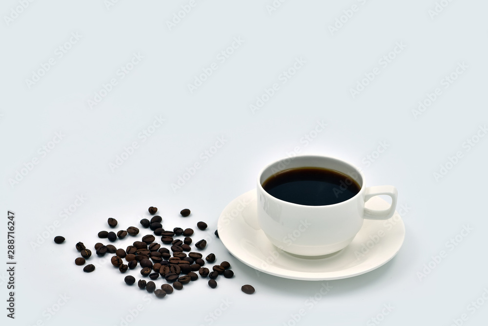 Cup of coffee and grains on a plain white background Cup of coffee and grains on a plain white background