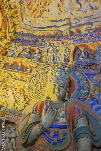 Wallpaper Mural Weathered colorful Buddha with little statues in cave 9 of the Yungang Grottoes near Datong Torontodigital.ca