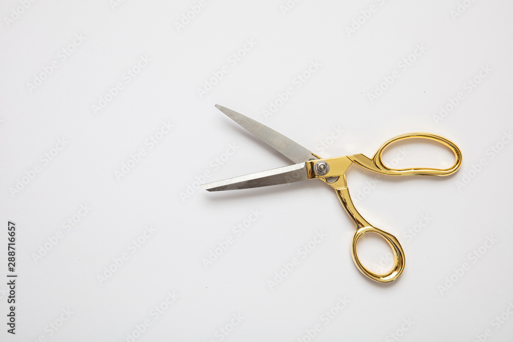 Scissors gold and silver isolated against white background Scissors gold and silver isolated against white background