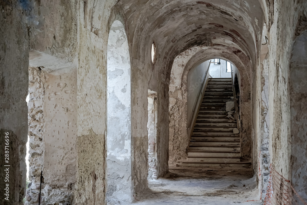 Fototapeta premium Corridor in an abandoned monastery