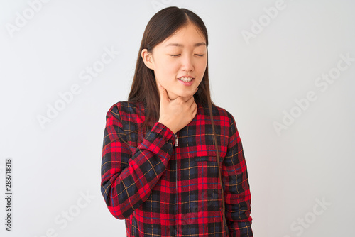 Young chinese woman wearing casual jacket standing over isolated white background Touching painful neck, sore throat for flu, clod and infection © Krakenimages.com