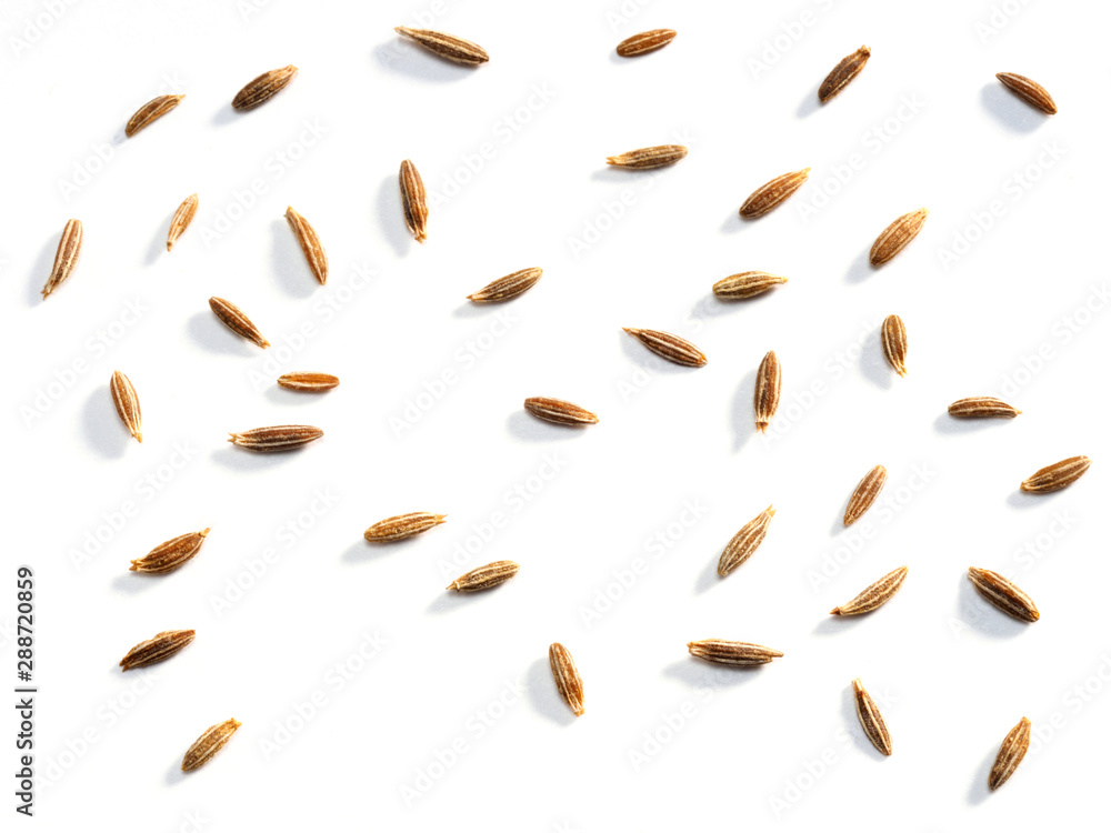 Cumin seeds (Cuminum), jeera on a white background. Macro photo Cumin seeds (Cuminum), jeera on a white background. Macro photo