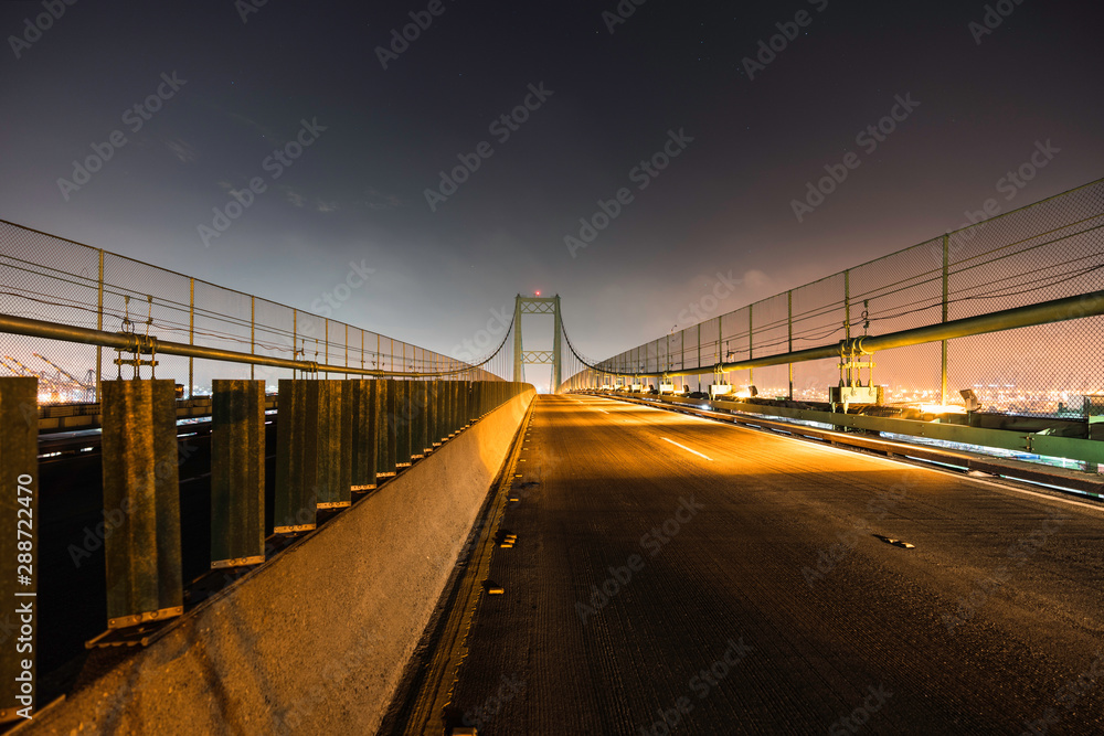 Night view of Vincent Thomas Bridge to Terminal Island in Los Angeles, California.  