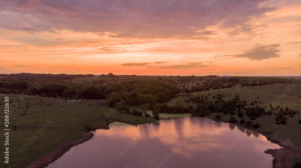 Sunrise over rural Nebraska wetland and stock pond Sunrise over rural Nebraska wetland and stock pond