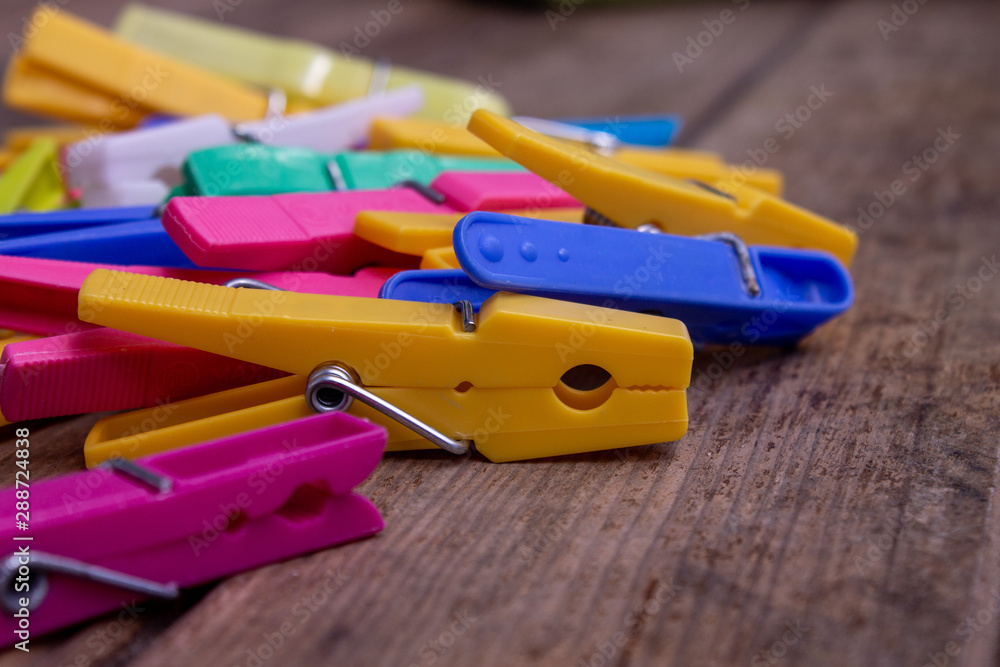 colorful clothespins on a table colorful clothespins on a table