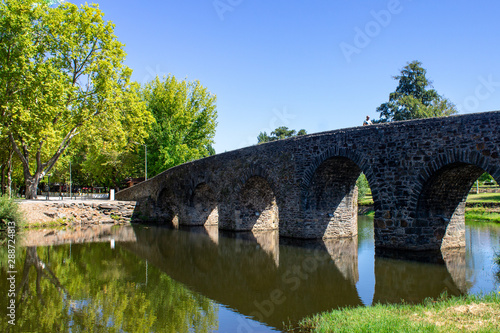 Roman old bridge over a river at Sertã, Portugal photo