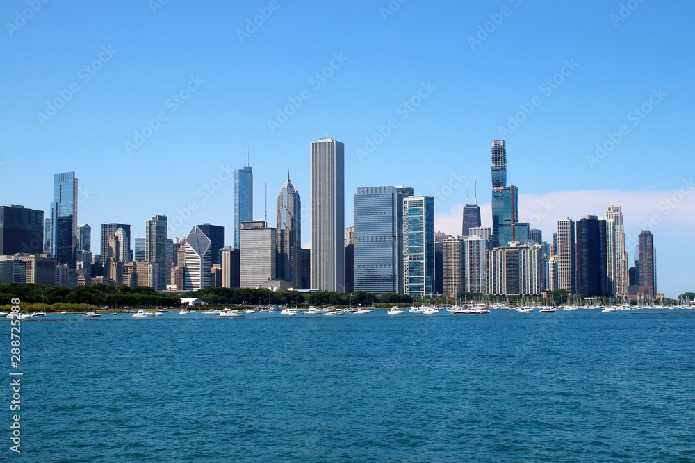 Chicago downtown skyline with Michigan lake.Scenic summer cityscape with lakefront skyscrapers of Chicago with drifting yachts on the Michigan lake harbor. American urban city architecture background.