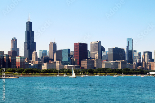 Chicago downtown skyline with Michigan lake.Scenic summer cityscape with lakefront skyscrapers of Chicago with drifting yachts on the Michigan lake harbor. American urban city architecture background.