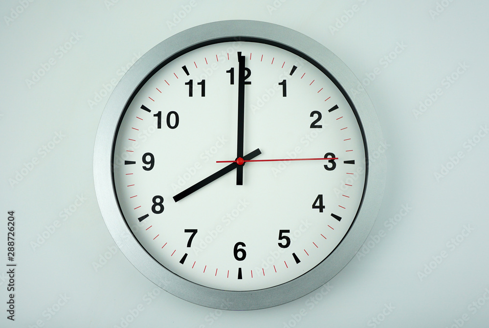 Gray wall clock face beginning of time 08.00 am or pm on White background, Copy space for your text, Time concept. Gray wall clock face beginning of time 08.00 am or pm on White background, Copy space for your text, Time concept.