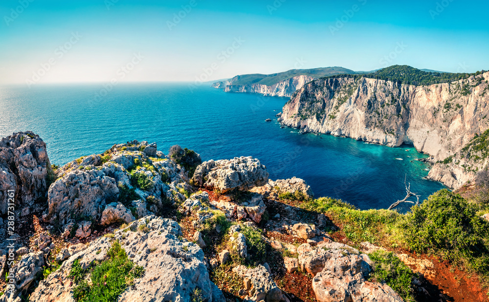Obraz premium Aerial spring view of high cliffs on the Ionian Sea. Bright morning seascape of Zakynthos (Zante) island, Greece, Europe. Beauty of nature concept background.