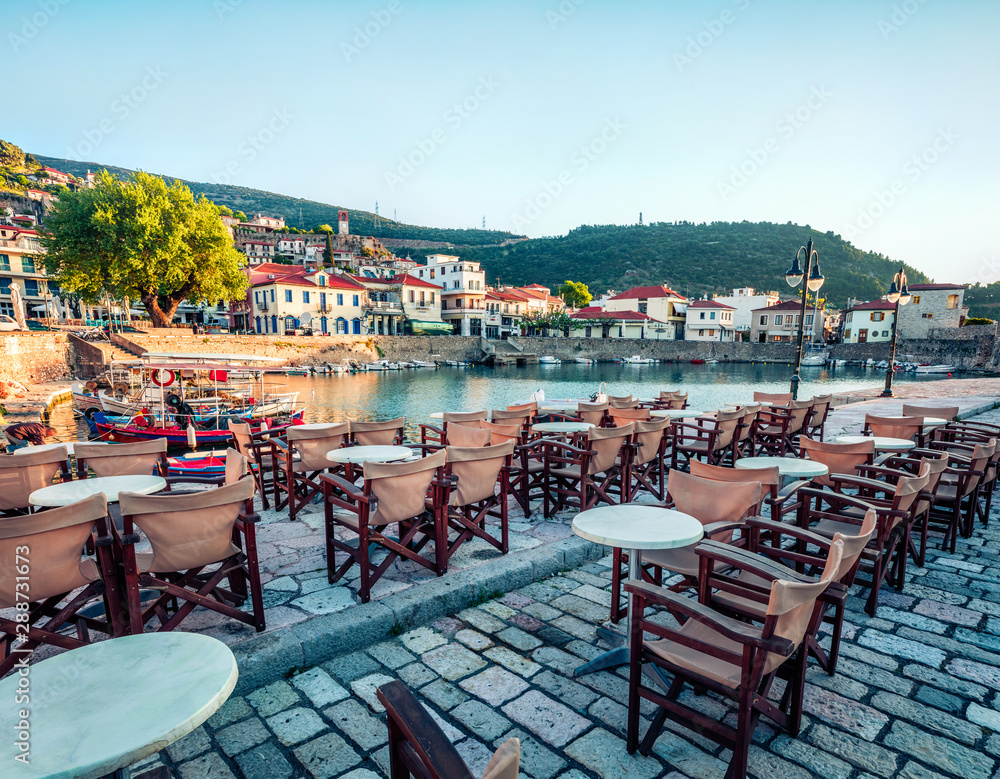 Colorful morning view of the Nafpaktos port. Sunny spring scene of the Gulf of Corinth, Greece, Europe. Beauty of countryside concept background. Traveling concept background.