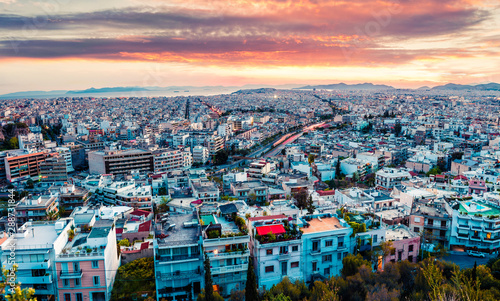 Aerial evening view of Athens, capital of Greece, Europe. Splendid spring sunset in the big sity. Traveling concept background. Artistic style post processed photo.