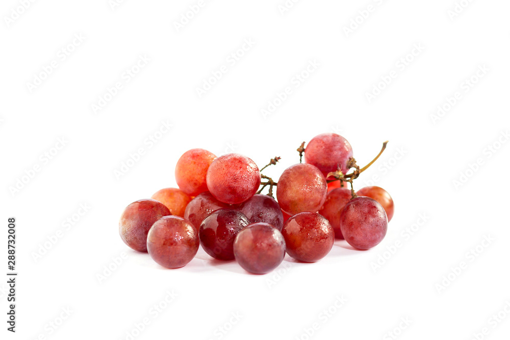 Closeup of red grapes with spray isolated on white background
