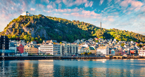 Beautiful summer view of Alesund port town on the west coast of Norway, at the entrance to the Geirangerfjord. Colorful sunset in the Nord. Traveling concept background. photo