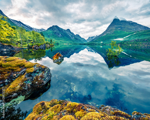 Great summer view of Innerdalsvatna lake. Breathtaking morning scene of Norway, Europe. Beauty of nature concept background. Artistic style post processed photo.
