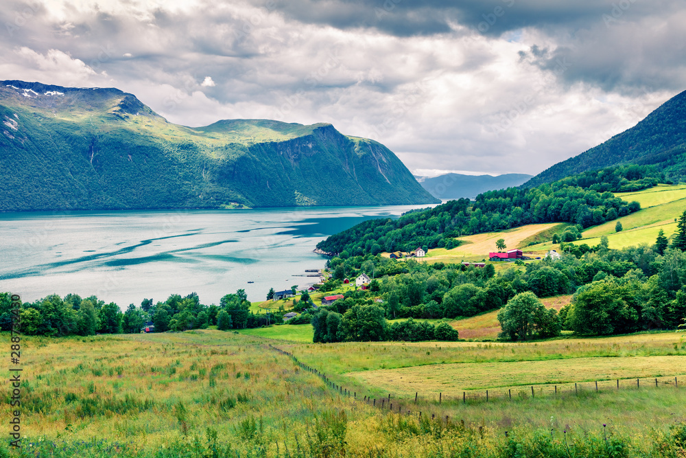 Typical countryside Norwegian landscape. Beautiful summer morning in Norway, Europe. Beauty of nature concept background. Instagram filter toned.