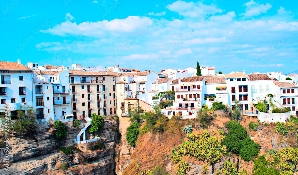 Houses in the hill of the valley of Ronda in the spanish village of  Malaga in a sunny day.