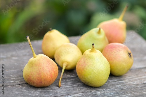 fresh pears on wooden table