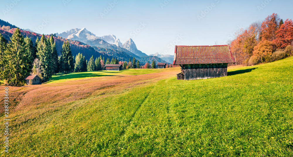 Stunning morning panorama of Zugspitze mountain range, Wagenbruchsee (Geroldsee) lake lacation. Wonderful autumn view of Bavarian Alps, Germany, Europe. Beauty of nature concept background.