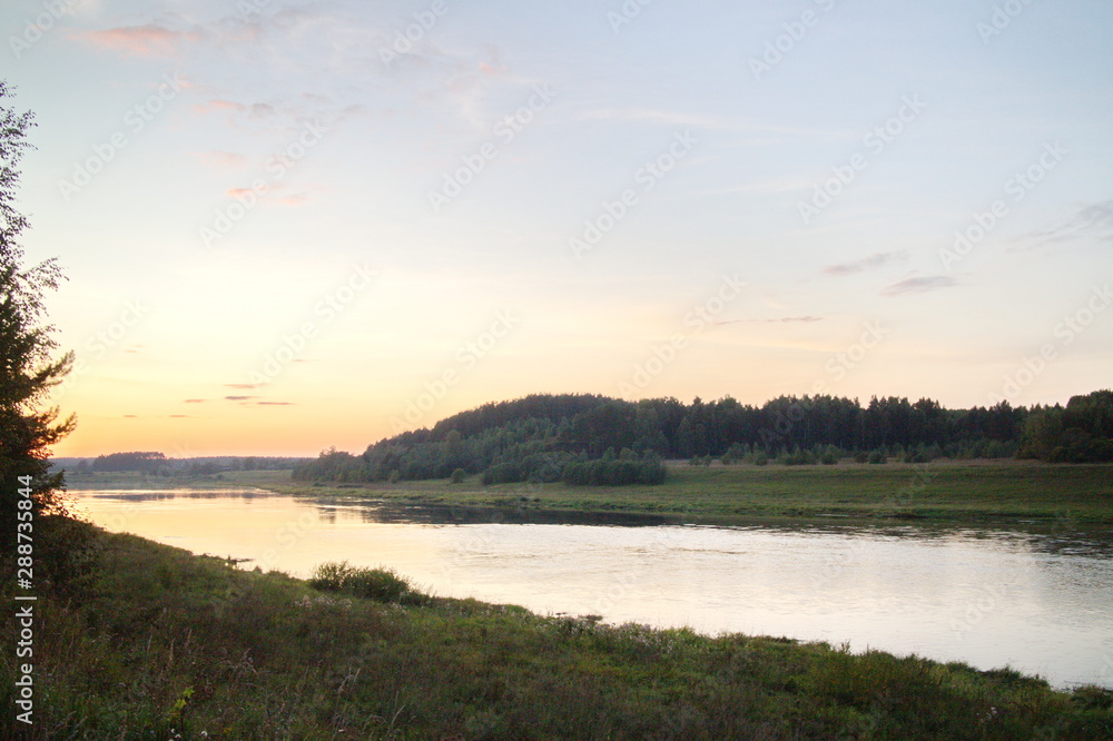 river in the evening after sunset in summer river in the evening after sunset in summer