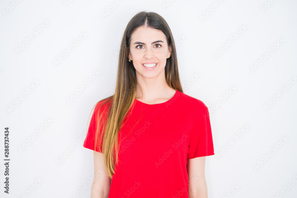 Young beautiful woman wearing casual red t-shirt over white isolated background with a happy and cool smile on face. Lucky person.