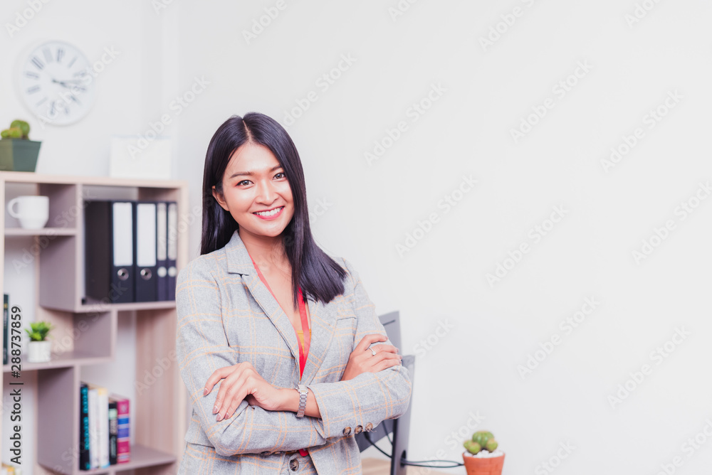 Happy Female business working in office, Asian woman accountant is currently audit work Happy Female business working in office, Asian woman accountant is currently audit work