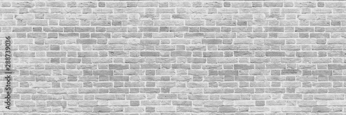 Panoramic background of wide old white brick wall texture. Home or office design backdrop