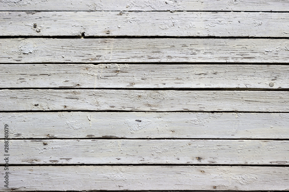 Obraz premium White wood background. Scratched white paint on a wooden plank wall. Background, texture
