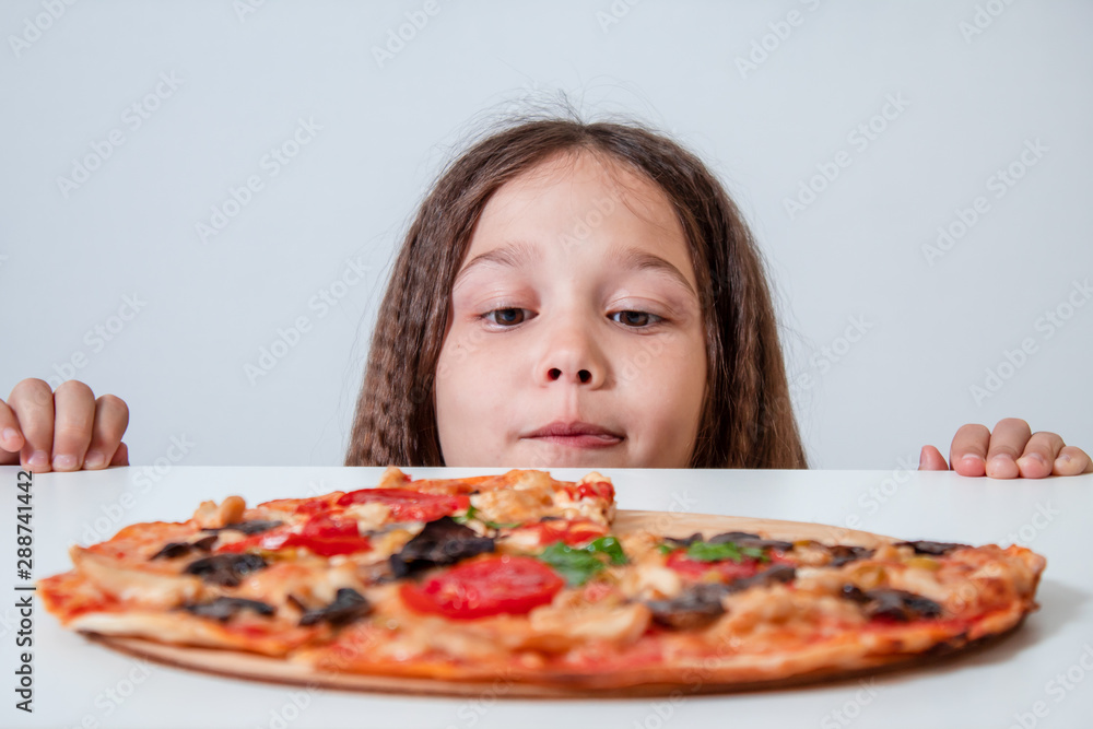 Little brunette girl eating pizza Little brunette girl eating pizza