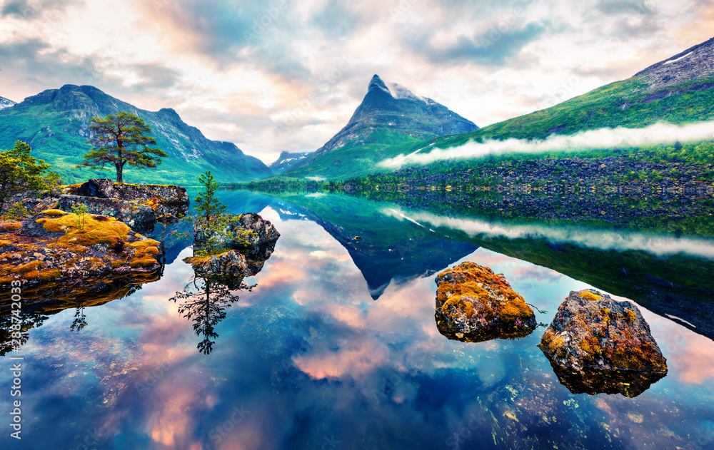 Unbelievable summer sunrise on Innerdalsvatna lake. Colorful morning scene in Norway, Europe. Beauty of nature concept background. Artistic style post processed photo. Orton Effect.. - obrazy, fototapety, plakaty 