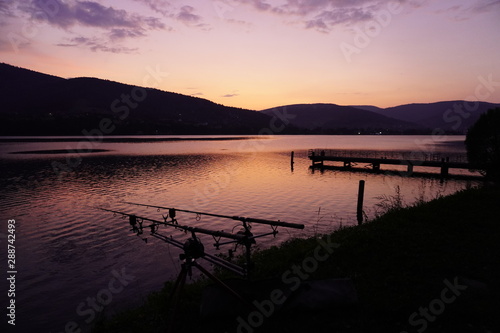 bright sunset in the mountains. outdoor activity. landscape in the mountains near the lake, multicolor sky and water in the lake