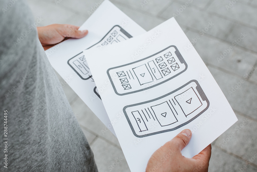 Naklejka premium UX mobile application wireframe. Sketch, prototype, framework, layout future app design project. UI/UX - user interface and user experience designer. Creative concept for smartphone. App development