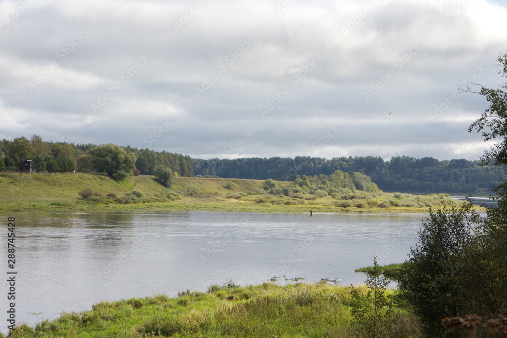riverbank in the countryside on a summer day riverbank in the countryside on a summer day